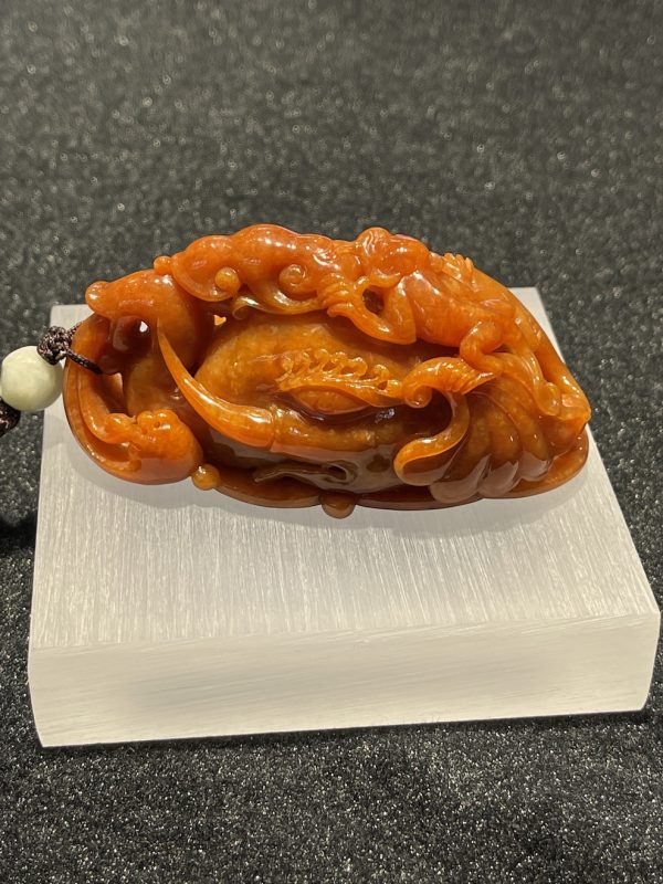 translucent reddish brown elephant with Pixiu carving jadeite ornament