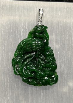 Translucent vibrant dark green phoenix jadeite pendant