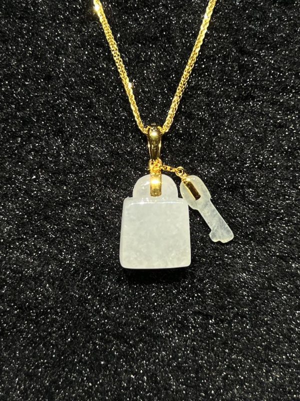 Icy translucent key and lock jadeite pendant