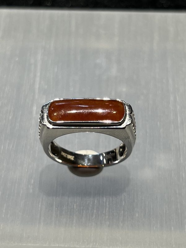 Icy translucent reddish saddle jadeite ring