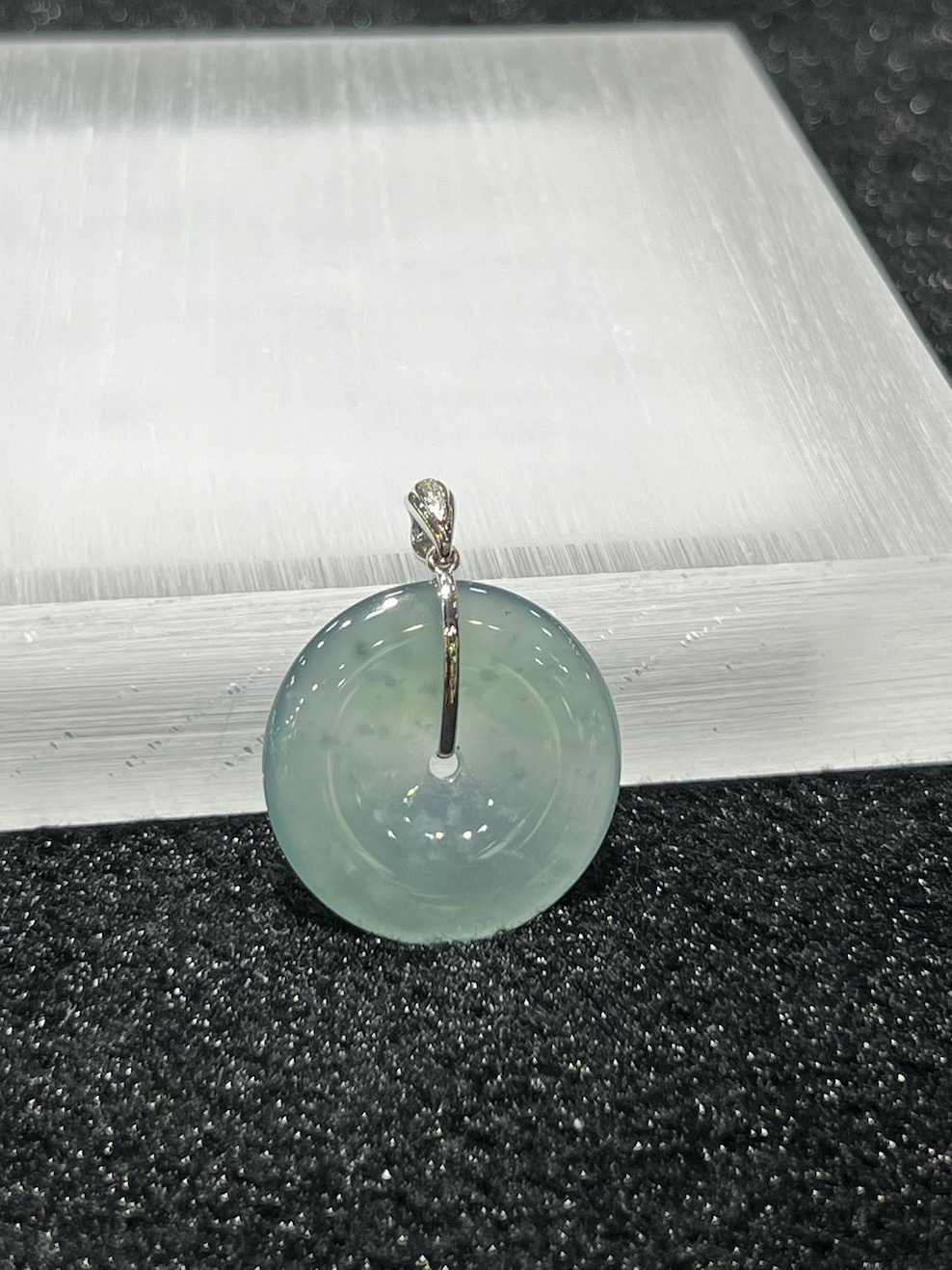 icy translucent bluish green safety knot jadeite pendant