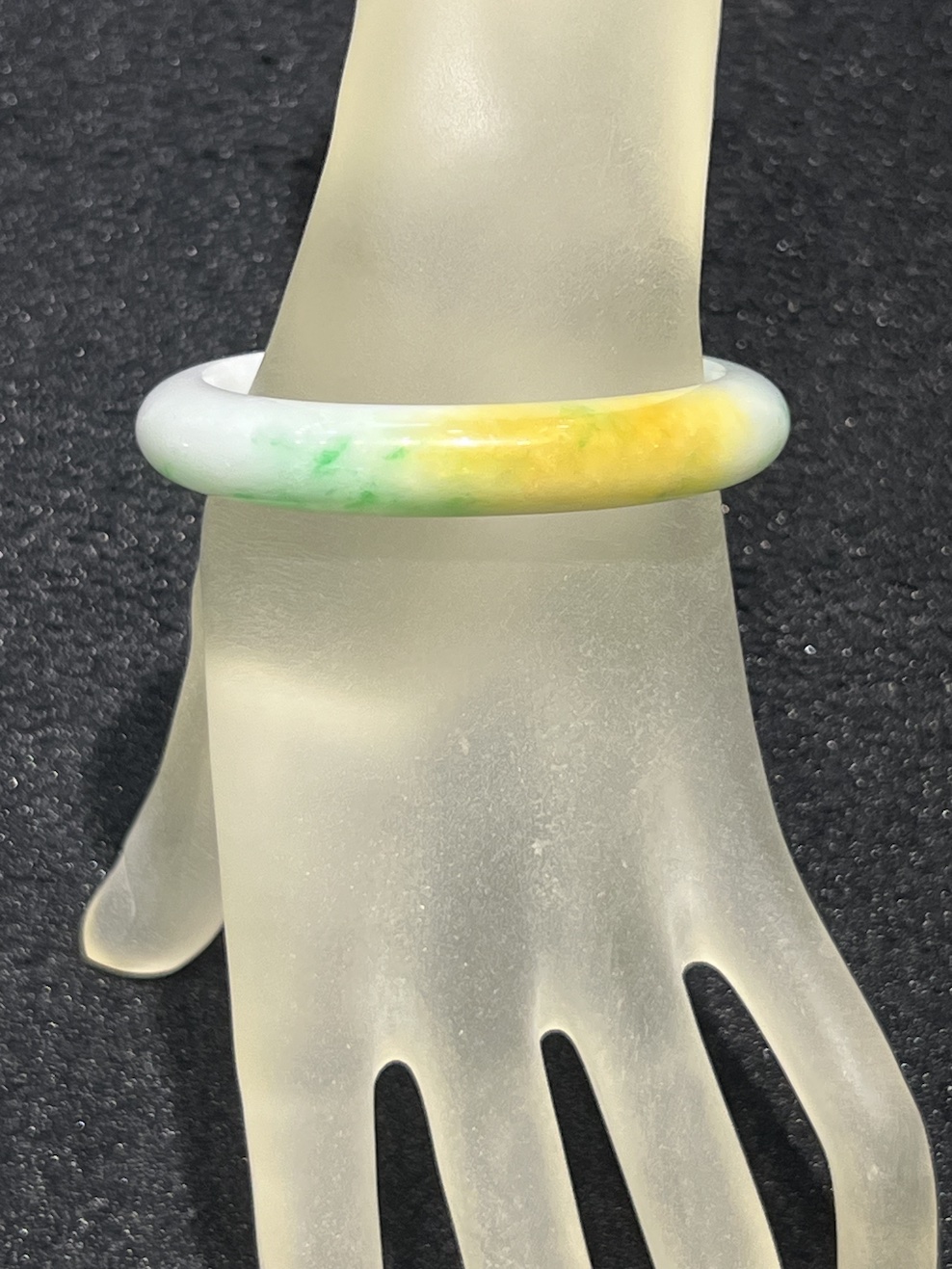 Translucent whiteish green with honey yellow jadeite bangle