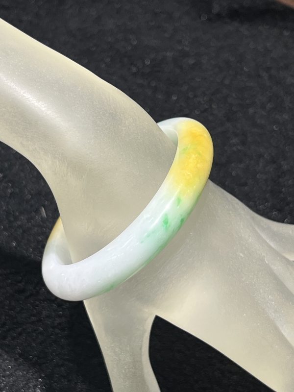 Translucent whiteish green with honey yellow jadeite bangle - Image 3