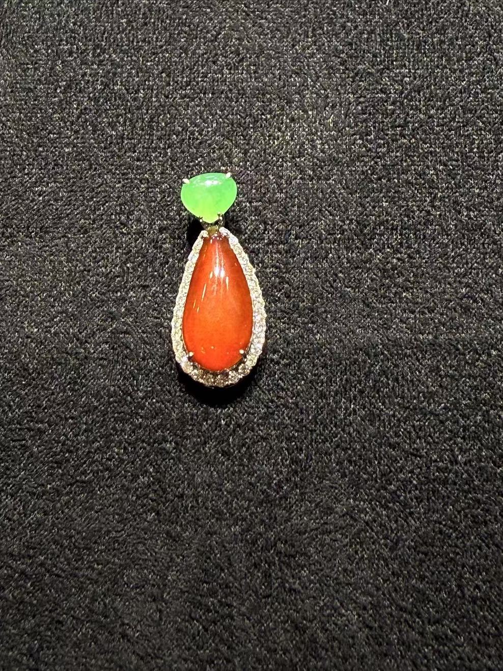 Translucent reddish teardrop shape jadeite pendant