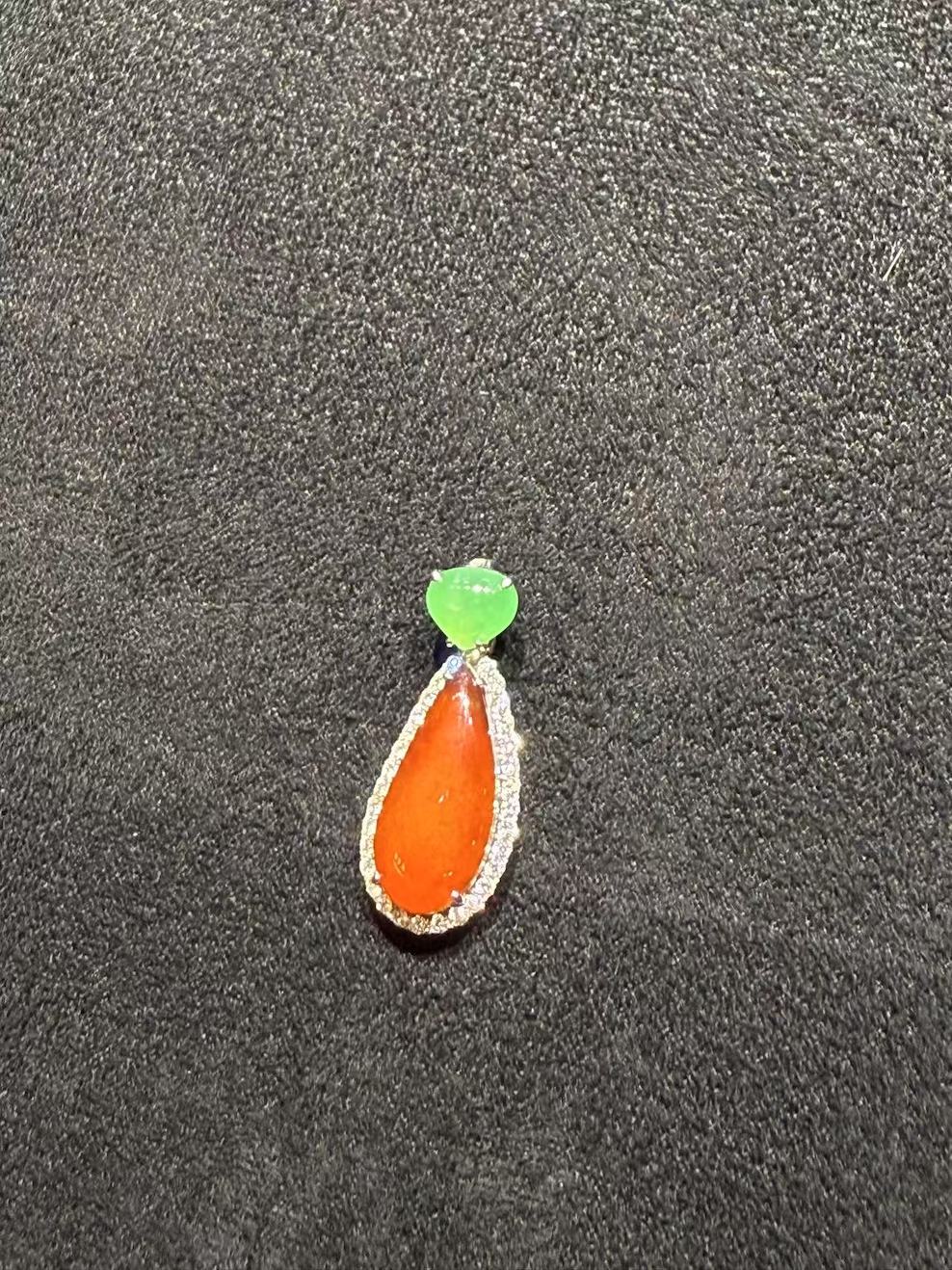 Translucent reddish teardrop shape jadeite pendant - Image 2