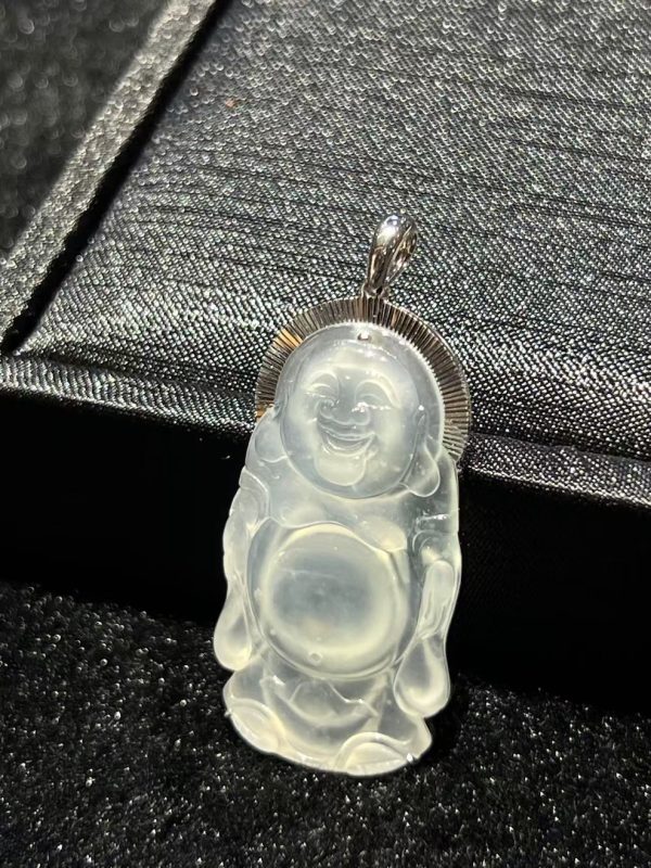 Highly translucent jade Laughing Buddha pendant in standing pose set in 18K white gold