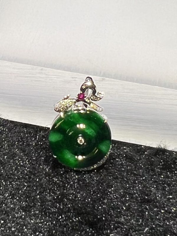 Old pit green jade safety coin pendant with diamond and ruby in 18K white gold