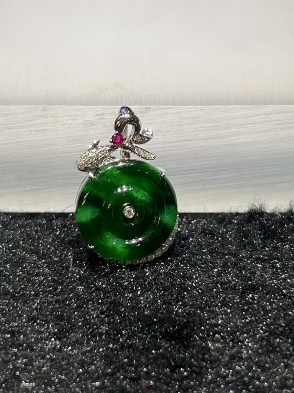 Old pit green jade safety coin pendant with diamond and ruby in 18K white gold