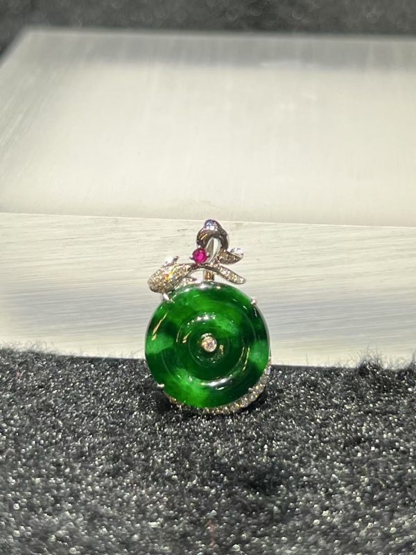 Old pit green jade safety coin pendant with diamond and ruby in 18K white gold