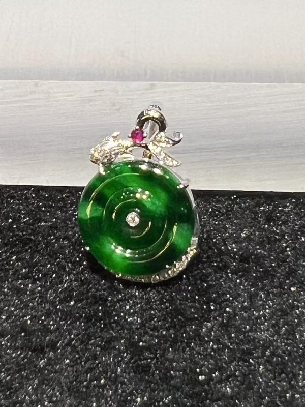 Old pit green jade safety coin pendant with diamond and ruby in 18K white gold
