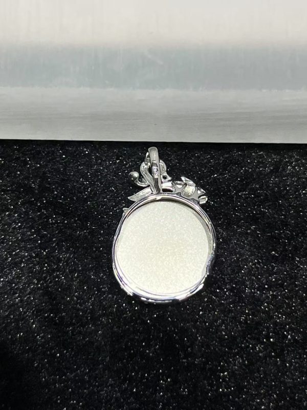 Old pit green jade safety coin pendant with diamond and ruby in 18K white gold