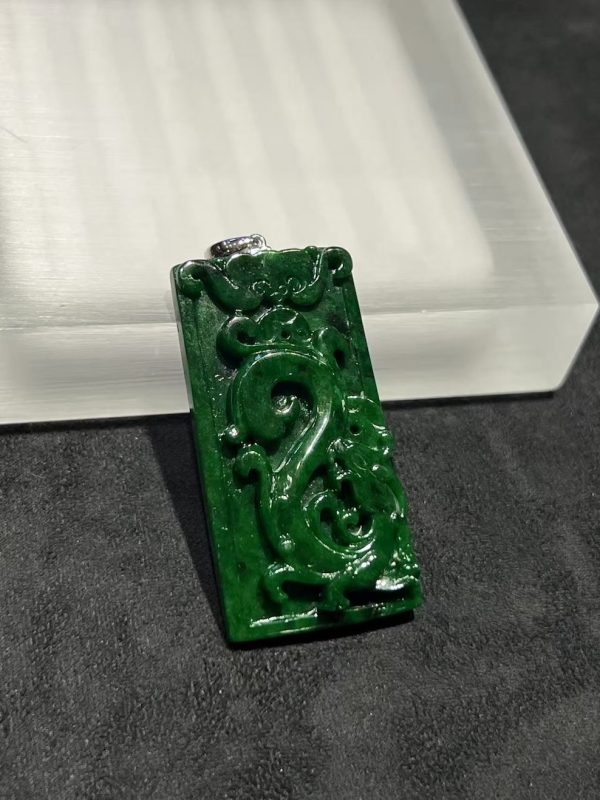 Translucent vibrant dark green dragon carving jade pendant