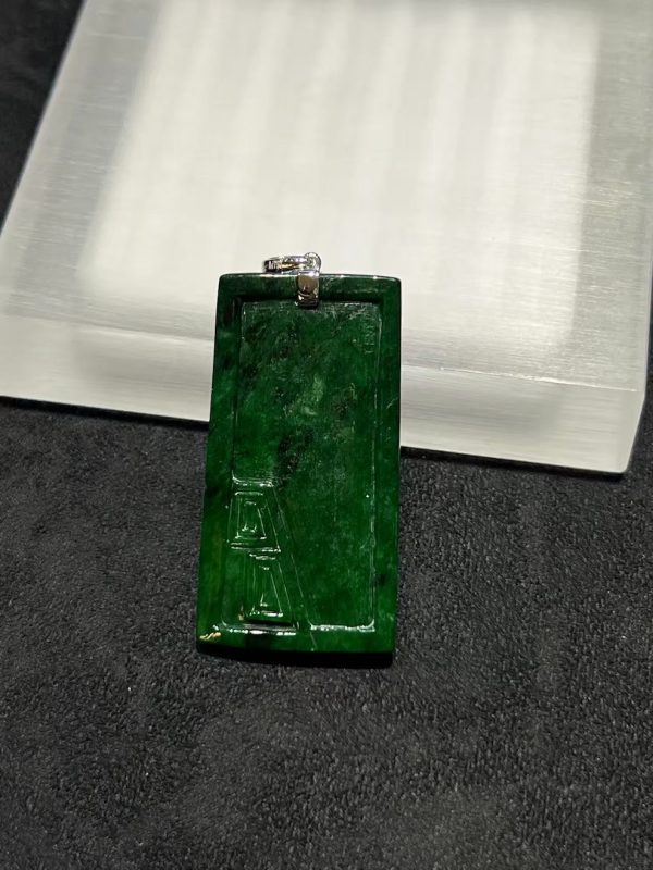 Translucent vibrant dark green dragon carving jade pendant