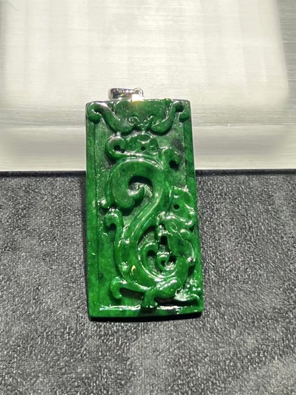Translucent vibrant dark green dragon carving jade pendant