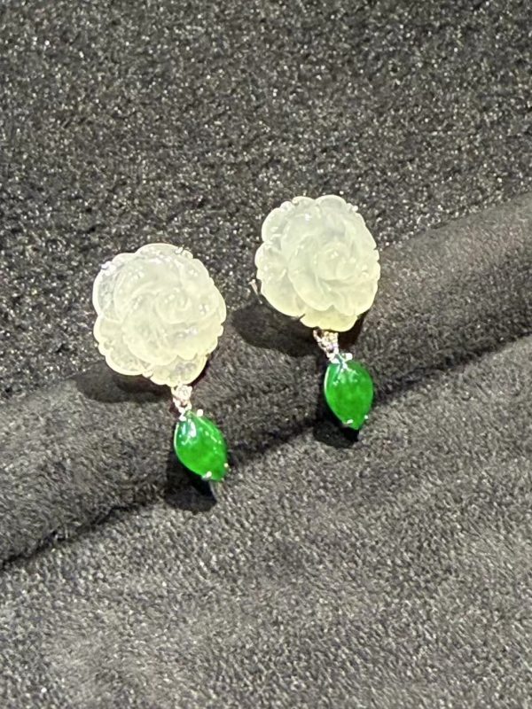 Translucent flower carving jade earrings with fancy-shaped green jade dangling in 18K white gold