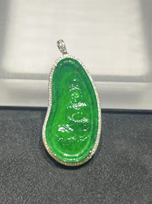 Icy translucent vibrant green Guanyin jadeite pendant with diamond setting in 18K white gold