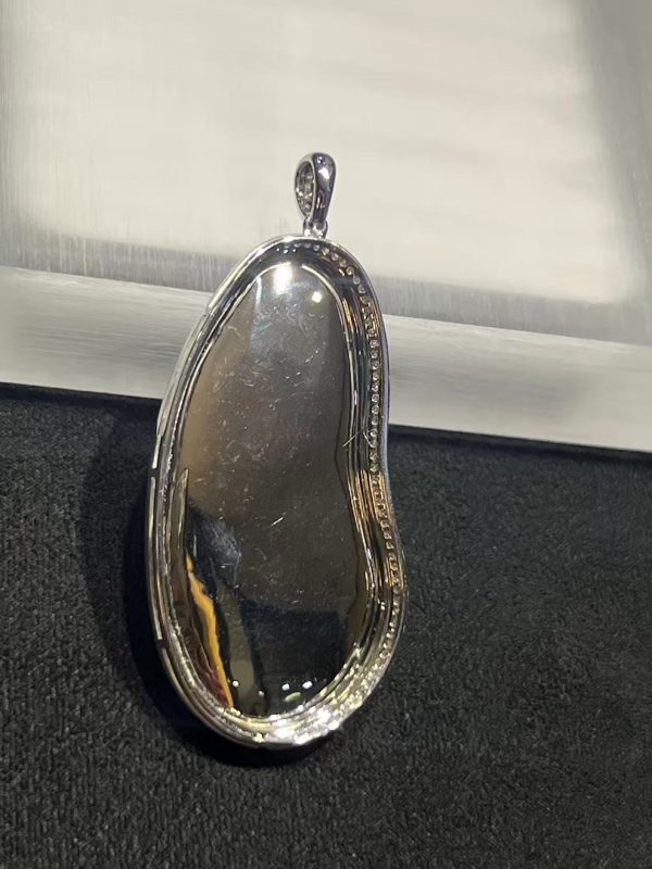 Icy translucent vibrant green Guanyin jadeite pendant with diamond setting in 18K white gold