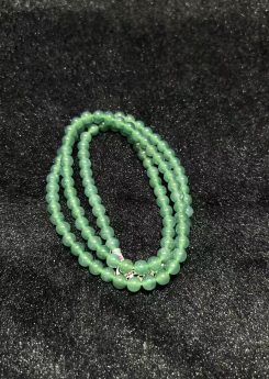 Translucent bluish jade bead necklace made from natural Type A jadeite, featuring luminous blue-green beads with elegant soft shine.