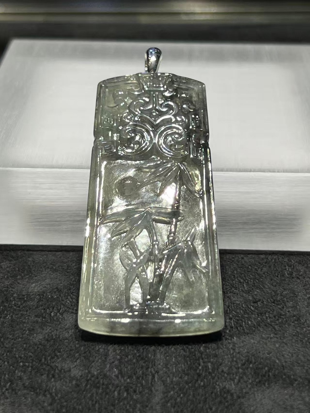translucent grey jadeite pendant with bamboo carving