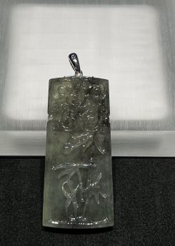 translucent grey jadeite pendant with bamboo carving