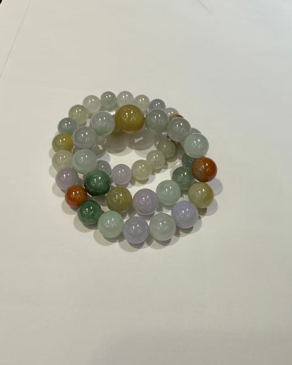 Translucent multi-colour jade bead necklace made of Type A natural jadeite in lavender, green, yellow, and russet hues — Nanyang Jade Singapore