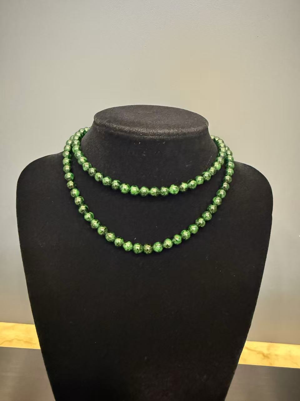 Translucent old pit green jadeite beads necklace with brass clasp, featuring vivid green colour and smooth polished surface