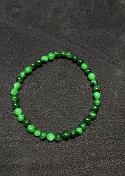 Translucent old pit green jadeite beads bracelet with natural Burmese jade in mixed green tones.