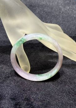 Translucent lavender jadeite bangle with soft green patches