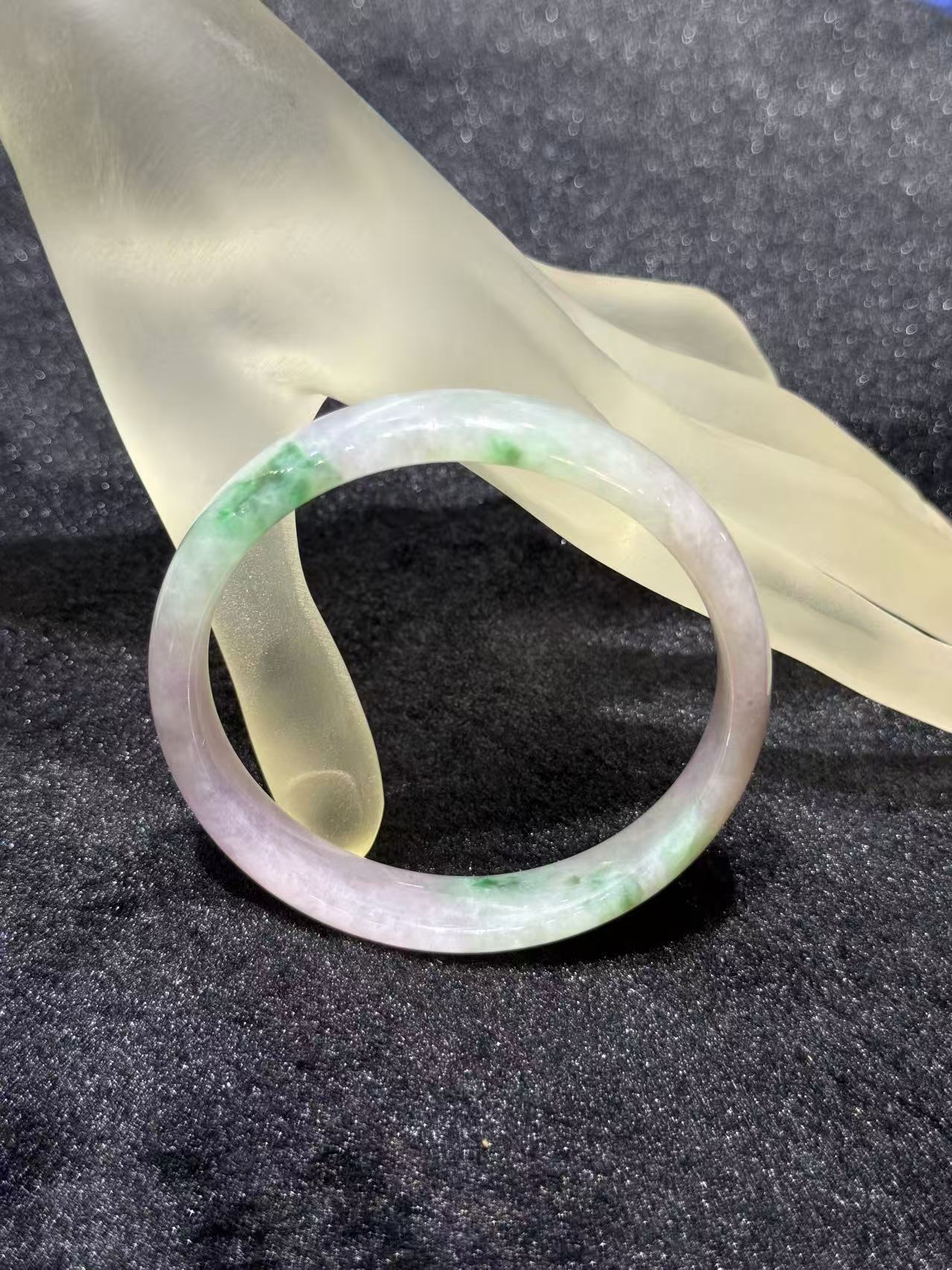 Translucent lavender jadeite bangle with soft green patches