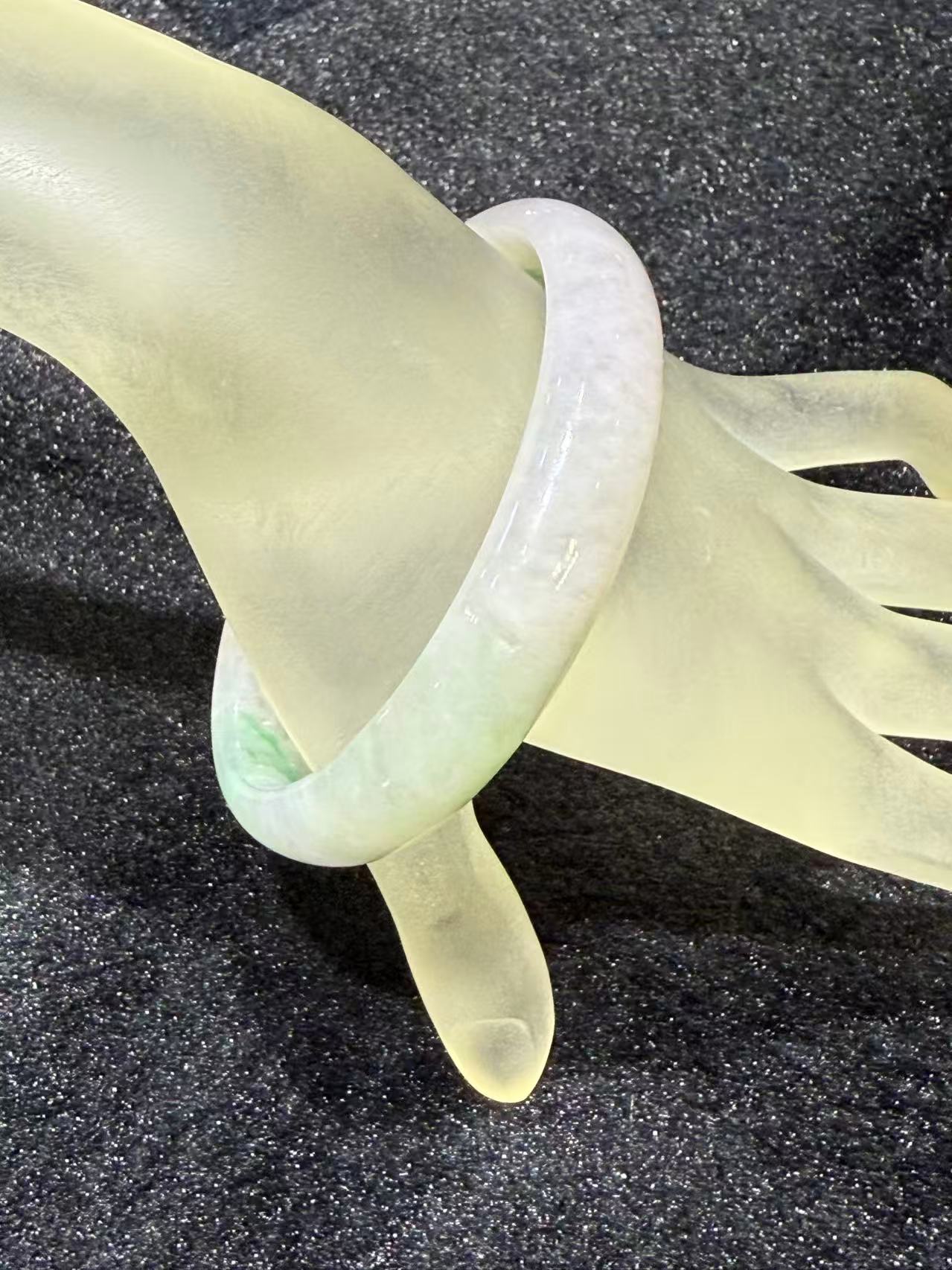 Translucent lavender jadeite bangle with soft green patches