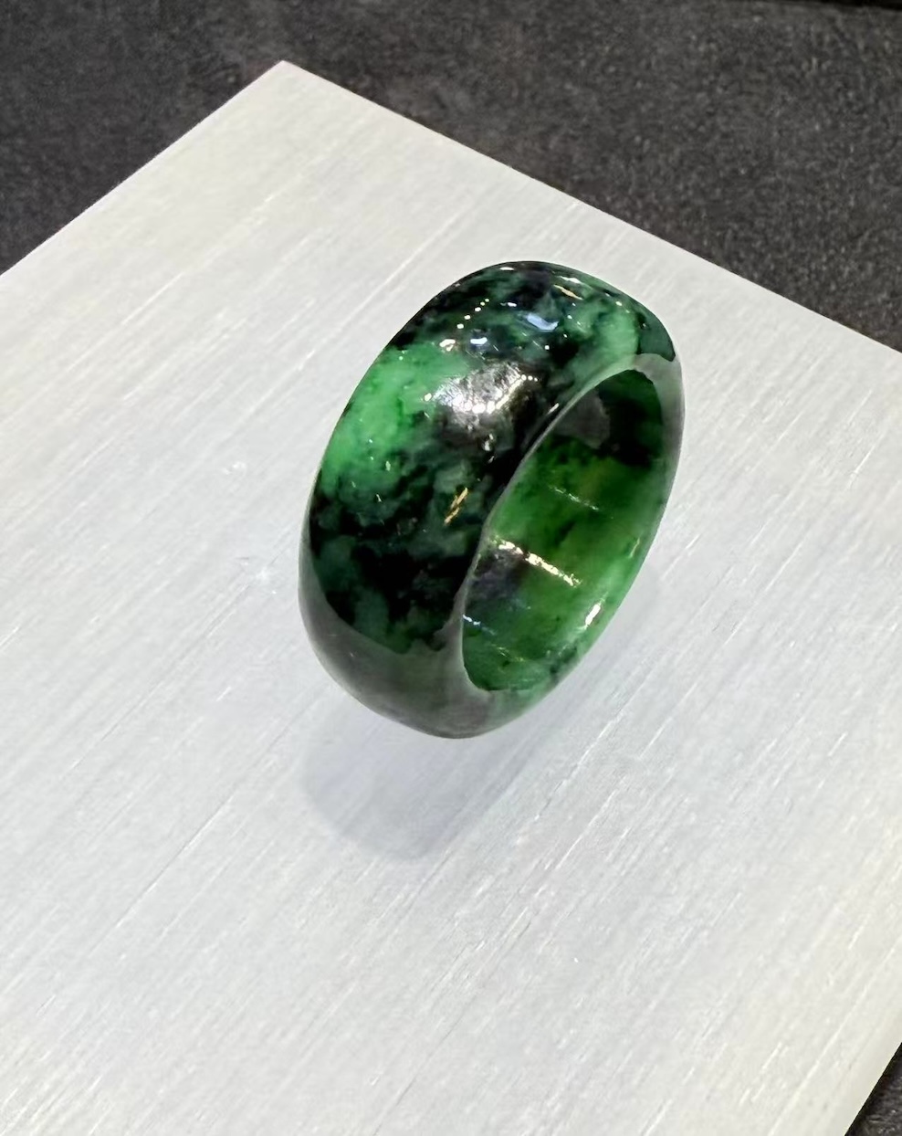 translucent old pit green jadeite ring with natural dark green tones