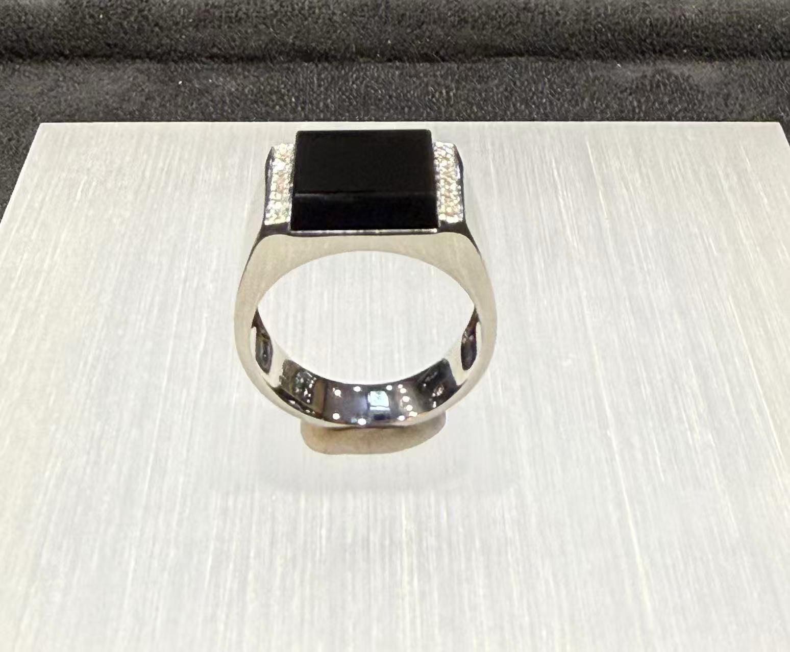 translucent omphacite black jadeite ring set in 18K white gold with diamond accents