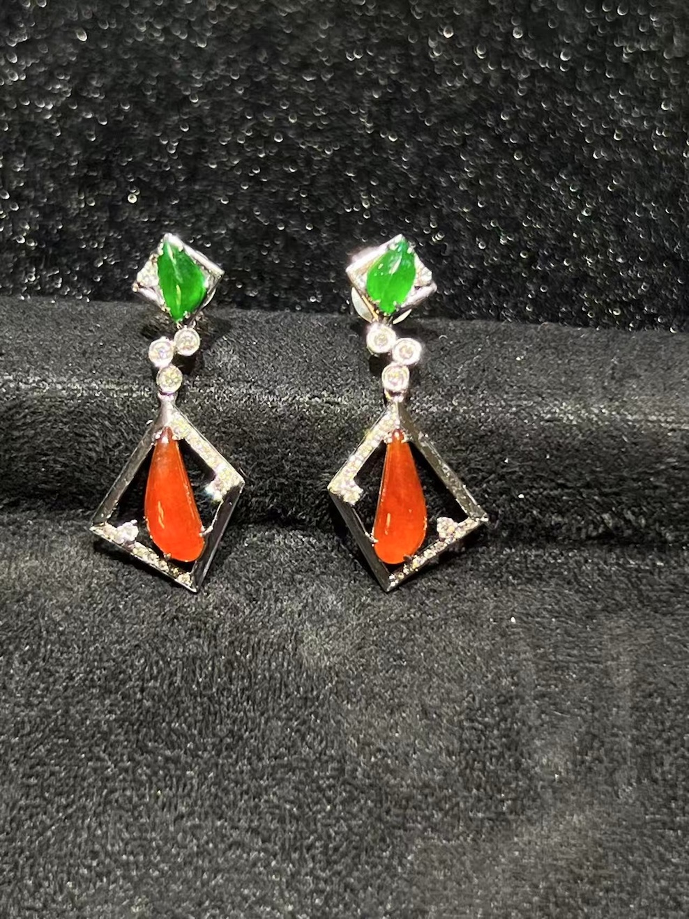 Highly translucent icy jadeite earrings with green and reddish fancy-cut jade set in 18k white gold and diamonds