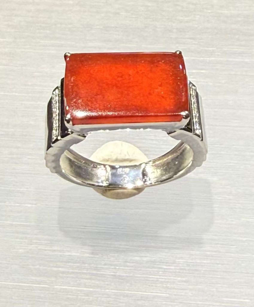 Natural Type A highly translucent reddish jadeite ring set in white gold