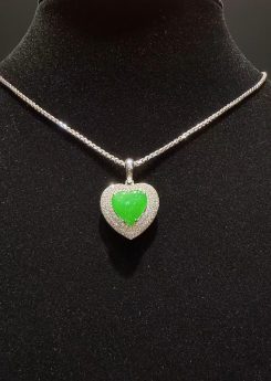 translucent icy green heart-shaped jadeite pendant set in 18K white gold with diamonds