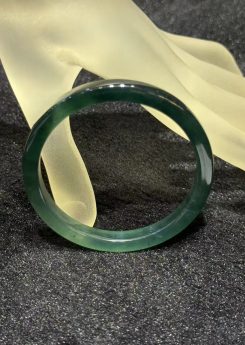 Translucent dark blue green jadeite bangle