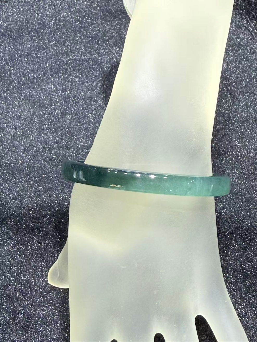 Translucent dark blue green jadeite bangle