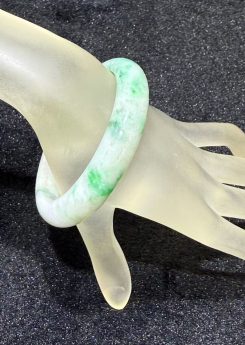Translucent whitish green jadeite bangle