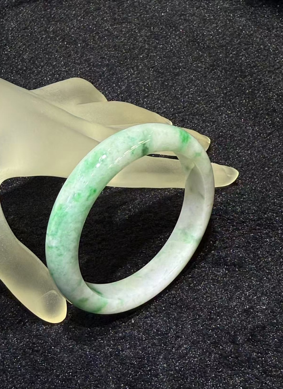 Translucent whitish green jadeite bangle