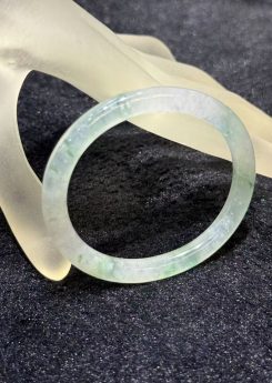 Natural Type A icy translucent jadeite bangle with floral green floating patterns