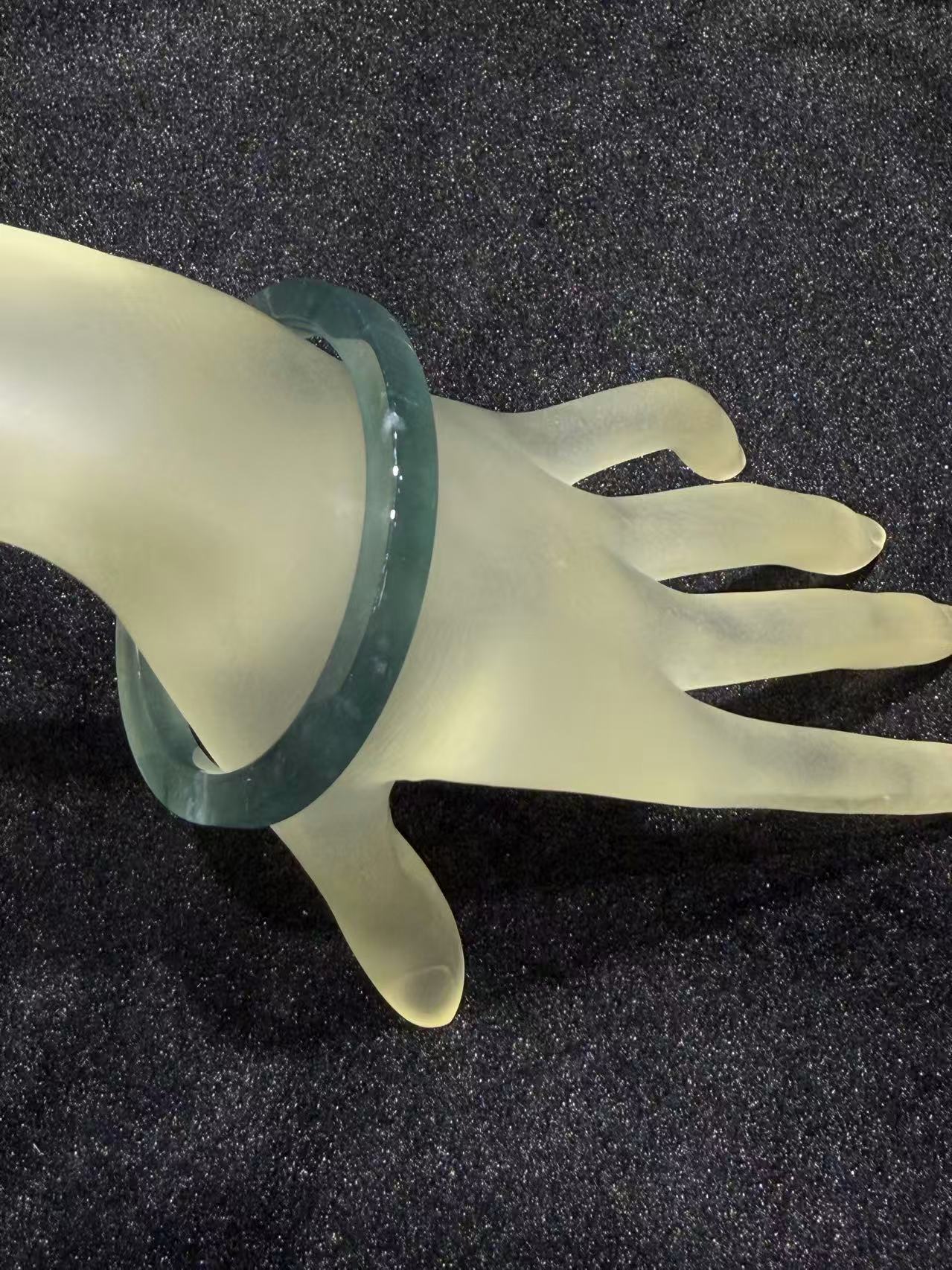 Translucent dark blue green jadeite bangle