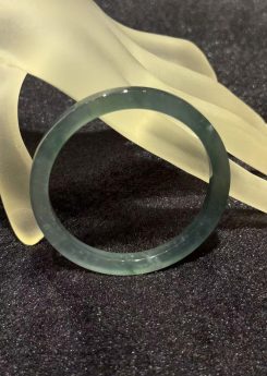 Translucent dark blue green jadeite bangle