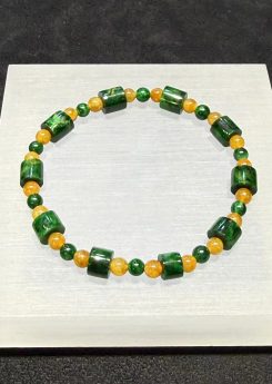 translucent green jadeite barrel bead bracelet with golden yellow beads