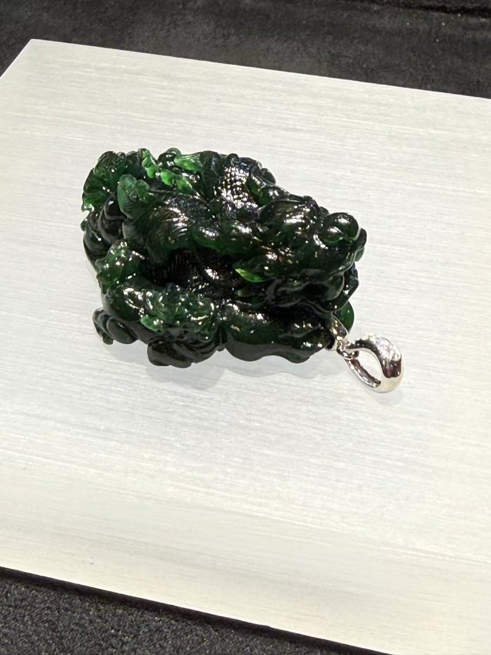 translucent dark green Pixiu jadeite pendant with detailed carving