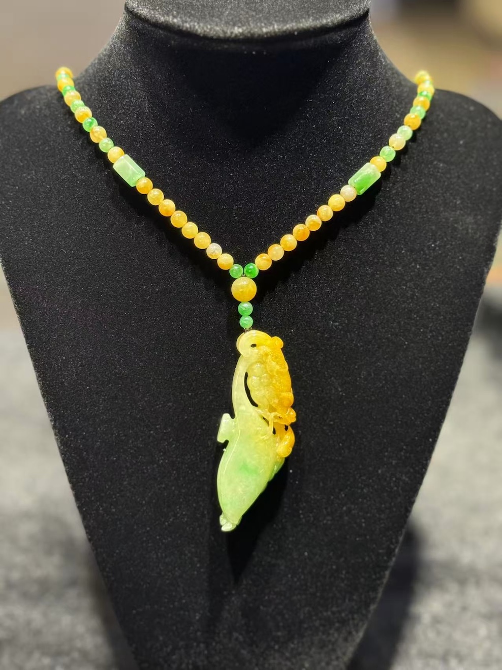 translucent yellow green dragon Ruyi jadeite pendant with detailed carving