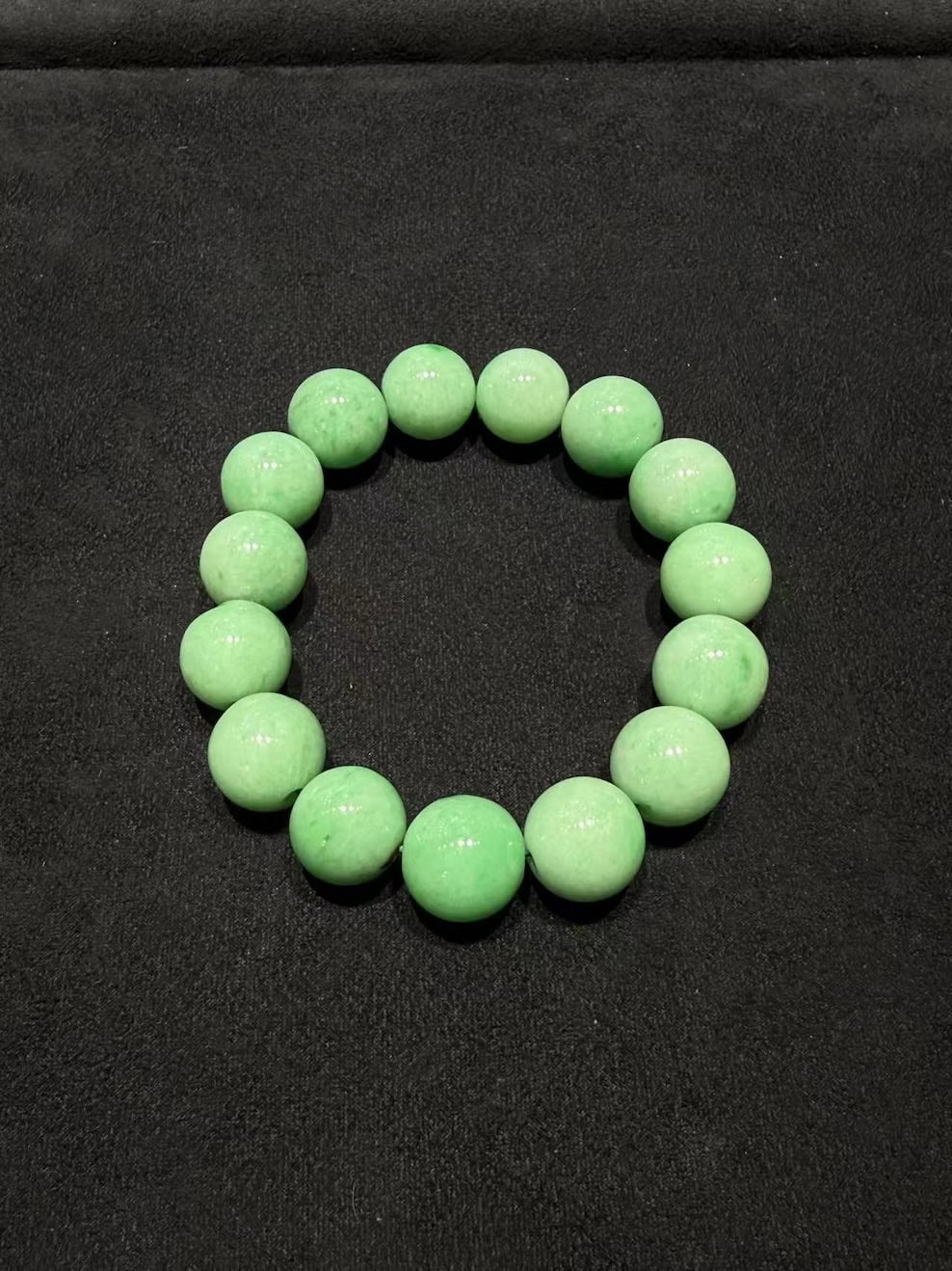 translucent apple green jadeite bead bracelet with smooth round beads