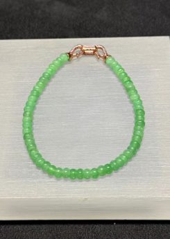 Apple green abacus jade bracelet strung with small icy translucent vibrant apple green jadeite abacus beads, finished with a brass clasp at the back