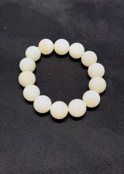 White nephrite bracelet strung with round natural nephrite beads in a soft, creamy white tone with a gentle waxy lustre