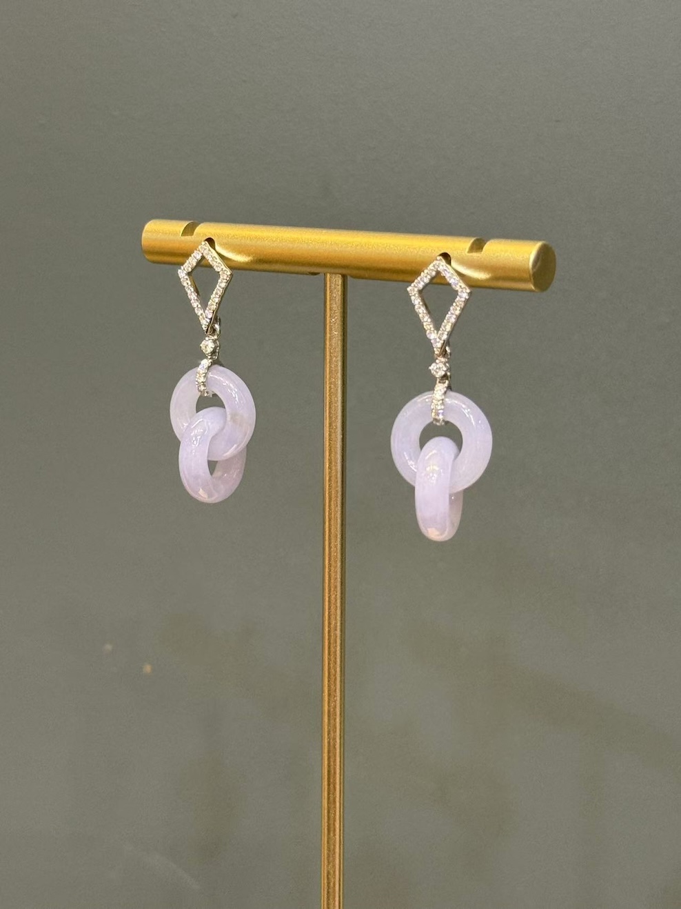 Lavender jade earrings with translucent pale lavender jadeite interlocking loops, hung from diamond-set 18k white gold kite-shaped studs
