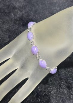 Lavender jade cabochon bracelet with five translucent lavender jadeite oval cabochons set in 18k white gold with diamond-set connecting links